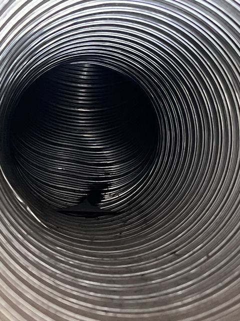 Inside of a round air duct after air duct cleaning in Palo Alto