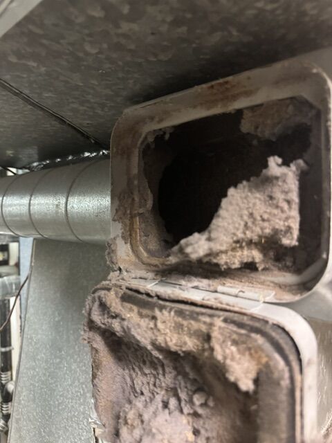 Lint packed inside a dryer duct, found during dryer duct cleaning