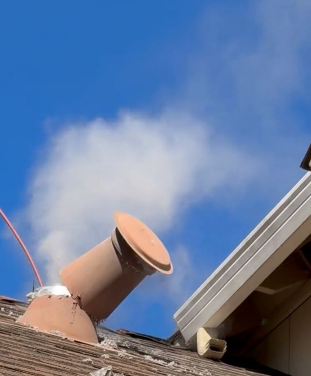 Dryer vent cleaning from the roof: lint blowing out of the vent cap