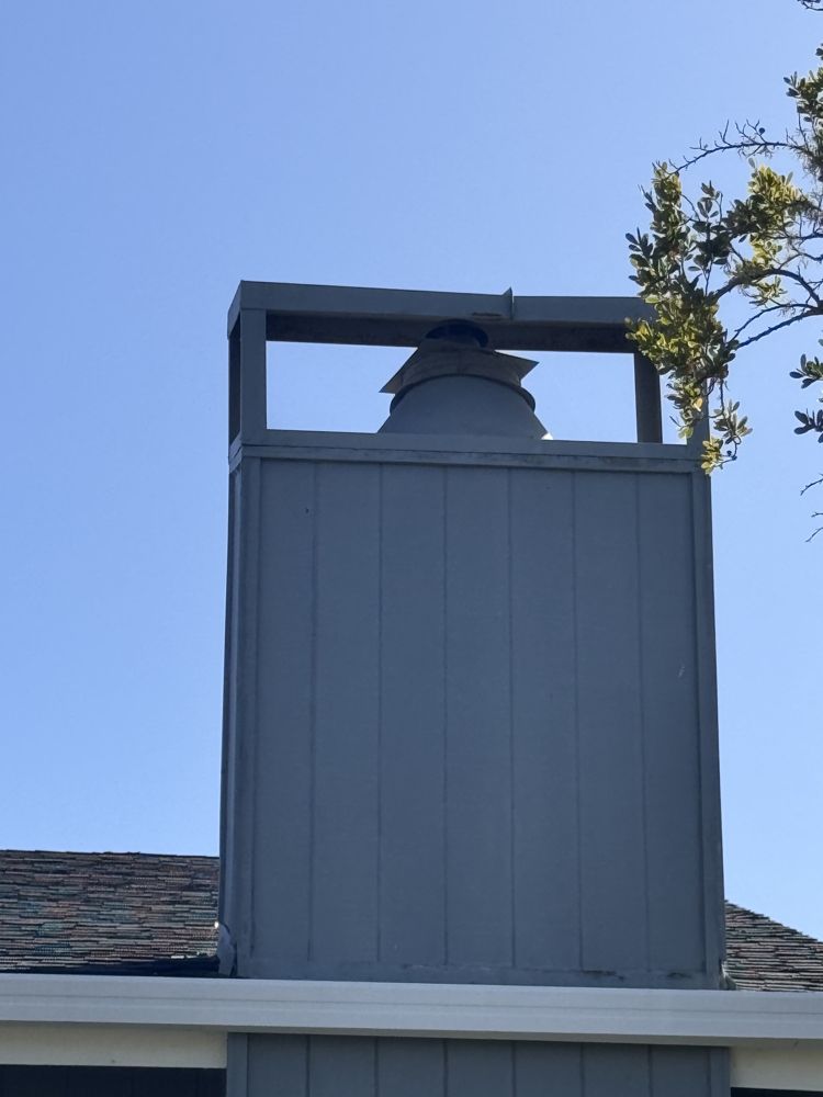 New chimney cap and shroud installed on a chase