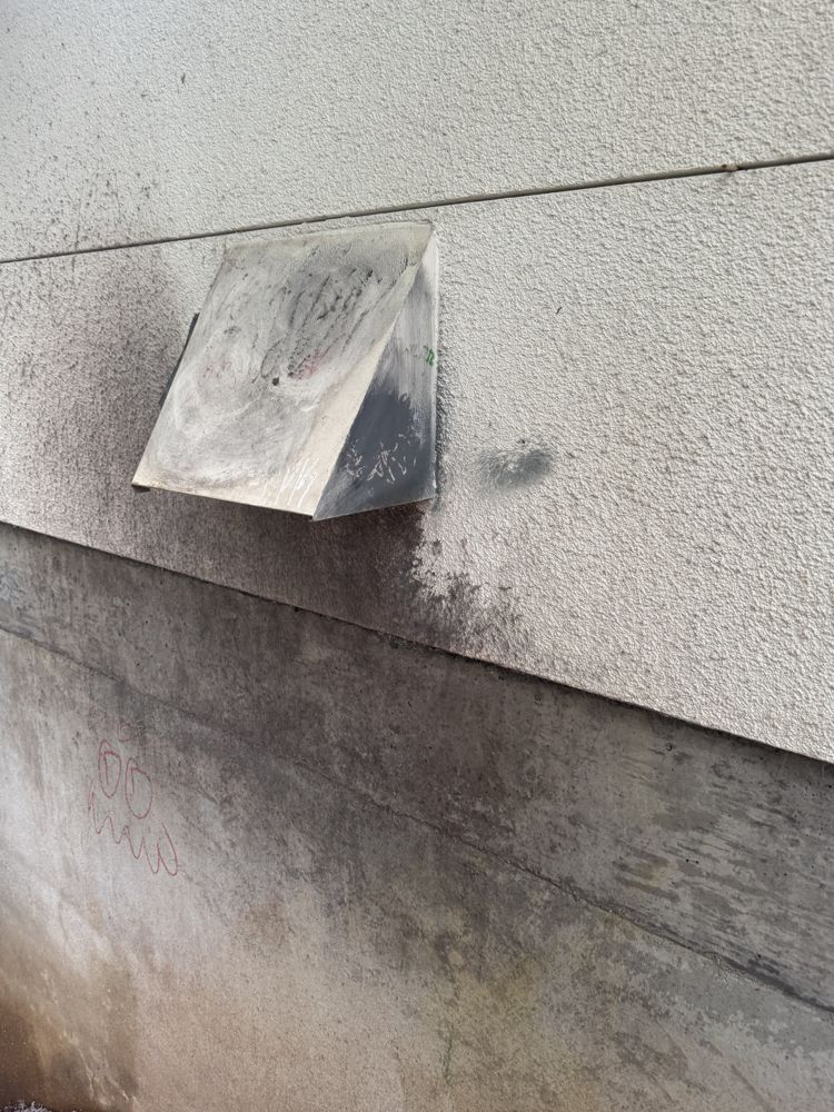 Exterior wall vent hood after cleaning