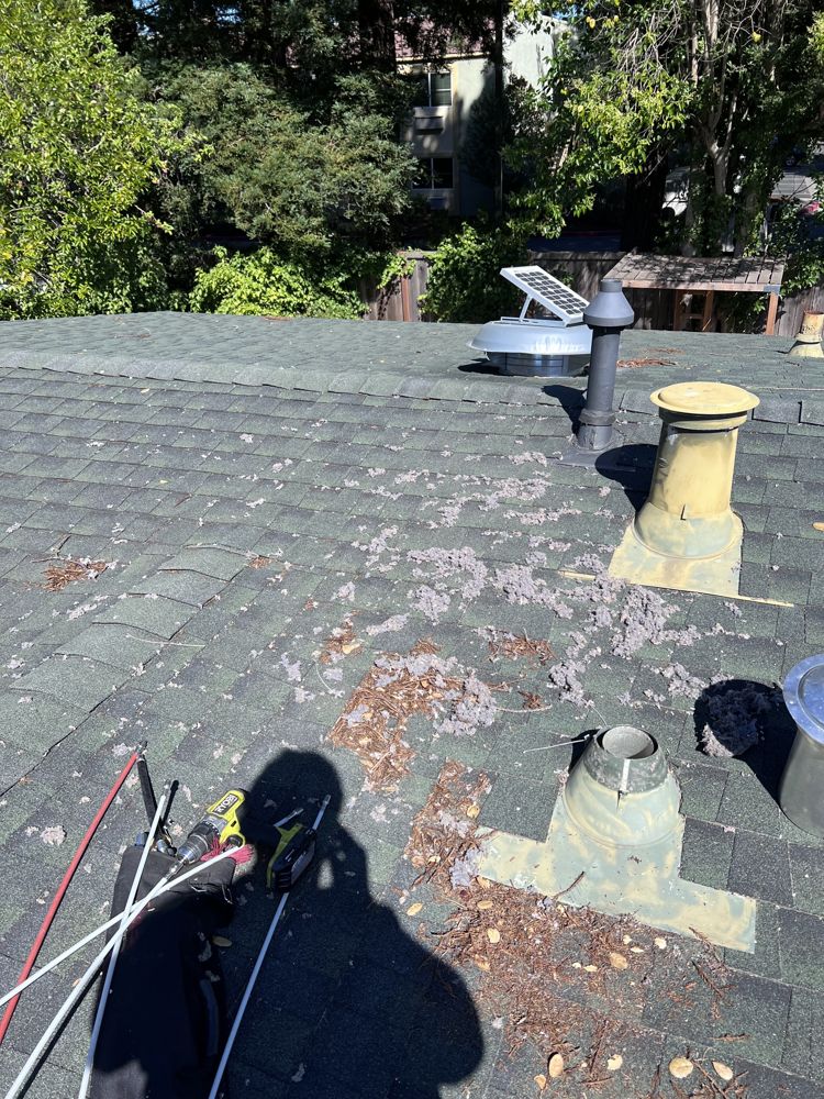 Roof dryer vent run being accessed for cleaning