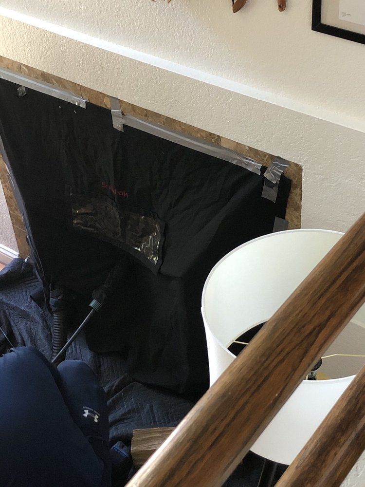 Fireplace covered with protective cloth during chimney sweep