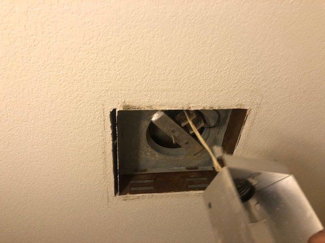 Bathroom fan after cleaning — clean and clear